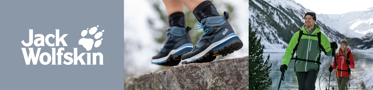 Mann und Frau wandern in verschneiter Berglandschaft